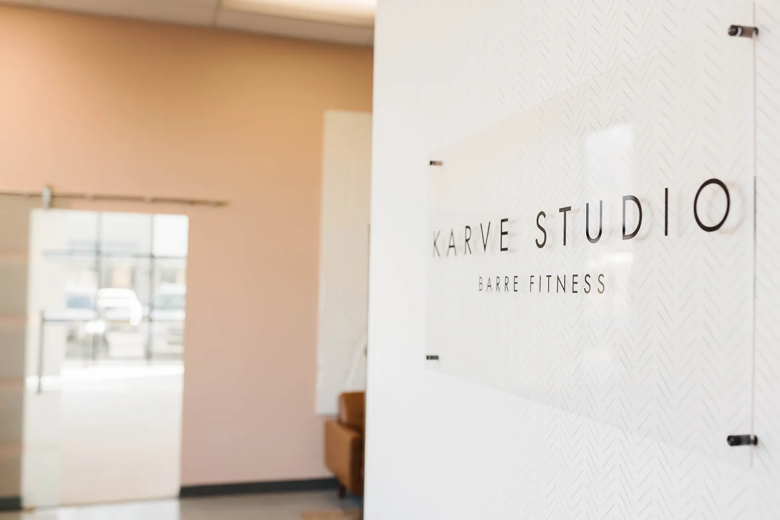 Karve Studio Barre Fitness lettering on the glass panel in the studio entry